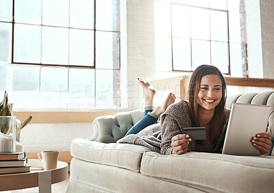 Buy stock photo Online shopping, ecommerce and credit card with digital tablet by woman on a sofa, happy and relax. Online banking, debit card and girl checking credit score, savings or membership in a living room