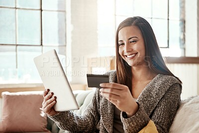 Buy stock photo Tablet, online shopping and credit card, happy woman on couch on retail app and internet banking in home. Technology, cashback payment and girl on sofa with smile on ecommerce website or digital shop