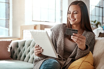 Buy stock photo Happiness, online shopping and credit card, woman on sofa and mobile app on tablet, internet banking in home. Technology, cashback payment and happy girl on couch on retail website or digital shop.