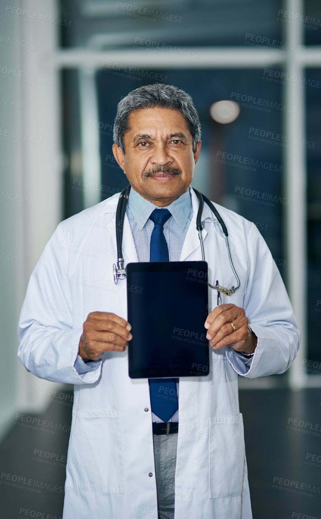 Buy stock photo Mature doctor, portrait and screen of tablet for hospital schedule, announcement or healthcare. Man, technology or mockup space for telehealth information on medical aid, prescription or test results