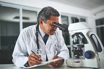 Buy stock photo Microscope, science and writing with man in laboratory for discovery, innovation or research. Experiment, medical and pharmaceuticals with mature scientist at desk for analysis of dna or sample