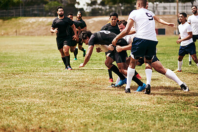 Buy stock photo Sports, outdoor and team of rugby players at match, training or competition with opponent. Tackle, fitness and men athletes playing game for practice, workout or exercise of skill on field at stadium