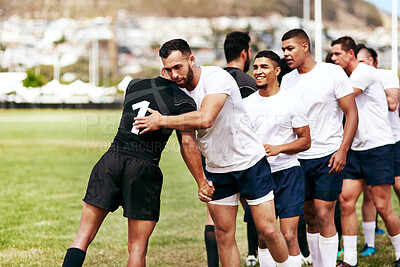 Buy stock photo Rugby, team and hug for respect, introduction or sportsmanship on grass field outdoors. Sports men shaking hands and greeting for game rival, competition or training with workout and exercise