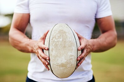 Buy stock photo Man, hands and rugby ball for match, outdoor and challenge with exercise, wellness and fitness. Male person, athlete and recreation facility as strong for game, sport and training in stadium or arena