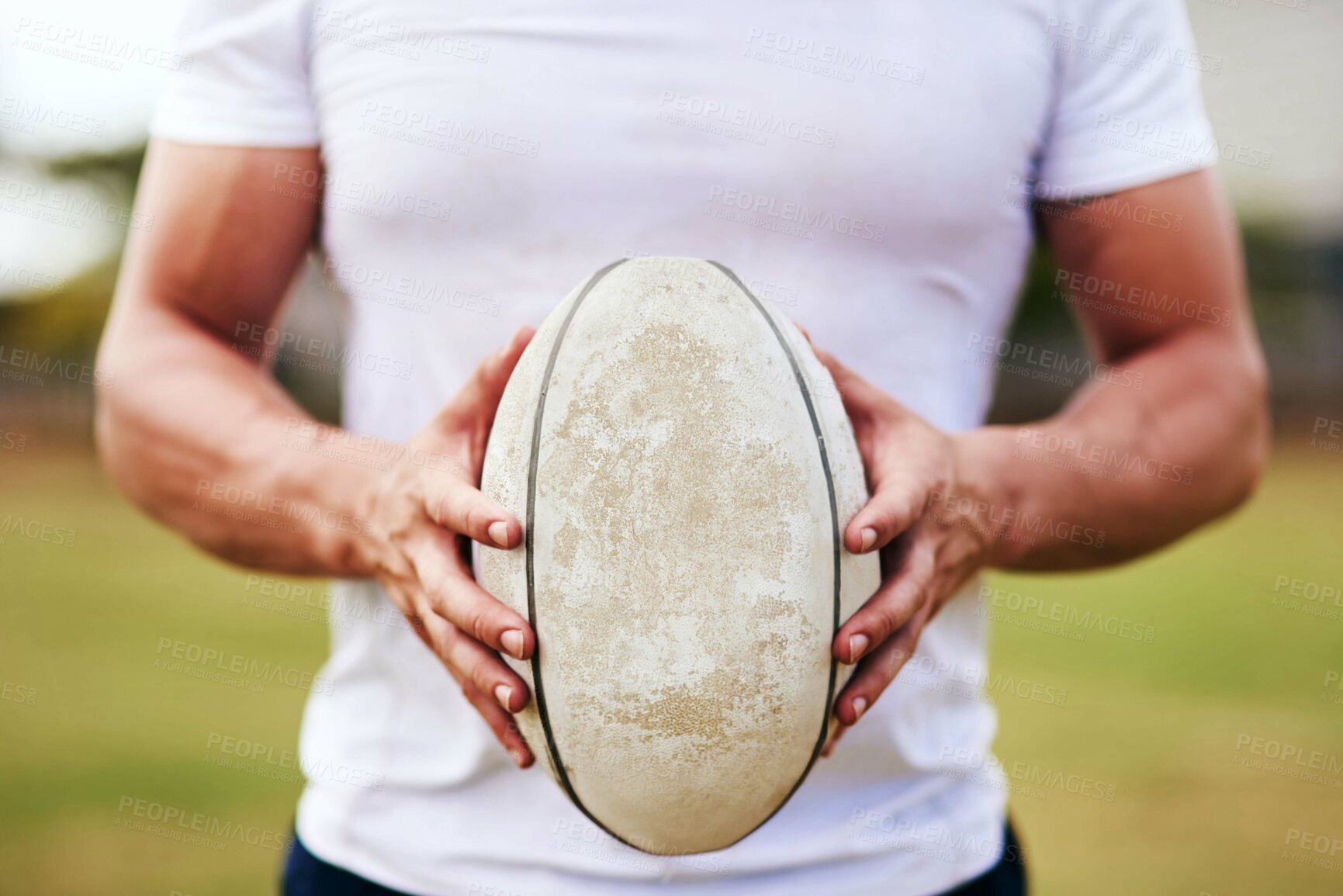 Buy stock photo Man, hands and rugby ball for match, outdoor and challenge with exercise, wellness and fitness. Male person, athlete and recreation facility as strong for game, sport and training in stadium or arena