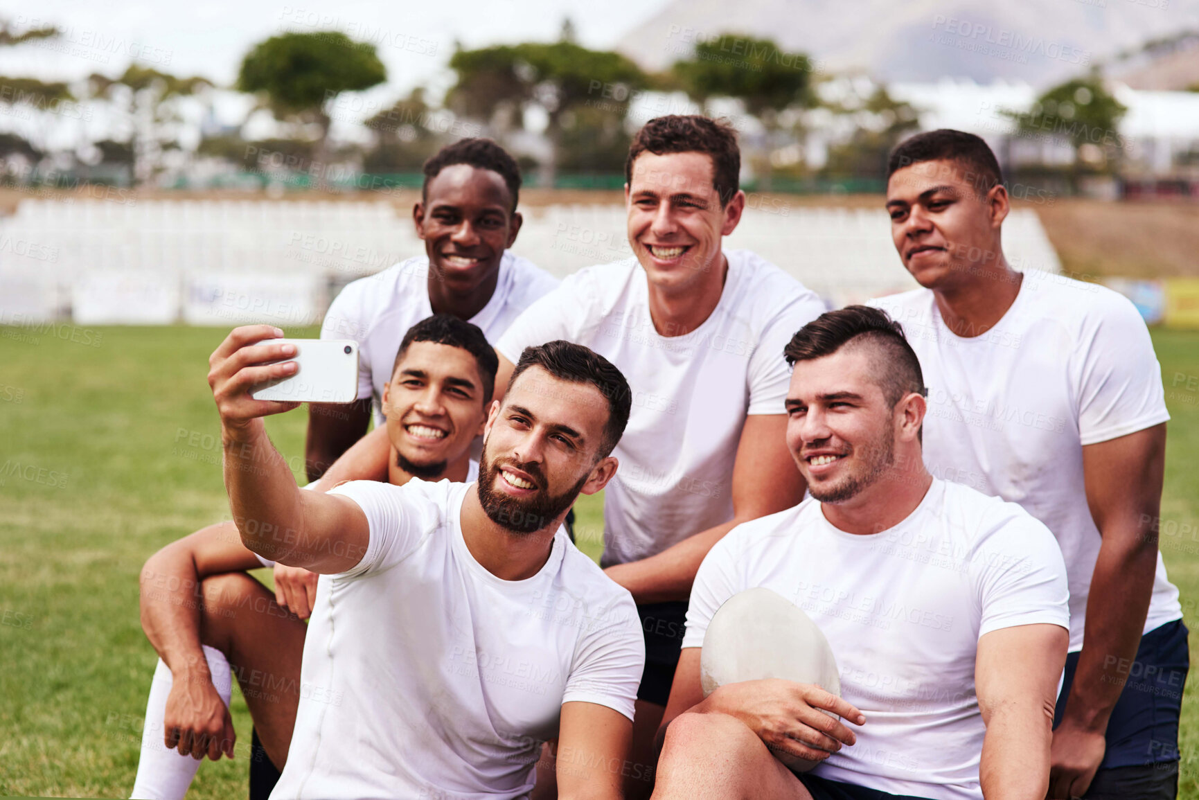 Buy stock photo Rugby, team and selfie for social media, profile picture or post together on grass field outdoors. Sports men, smartphone and smile for game, competition or training with workout and exercise club