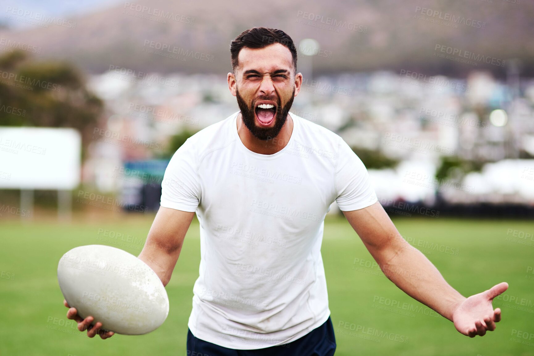 Buy stock photo Man, portrait and rugby ball with energy, exercise and fitness for games, outdoor and challenge. Male person, athlete and recreation facility in stadium for match, sports event and training in Wales