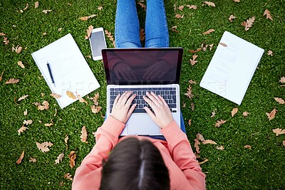 Buy stock photo Student, laptop and notebook on grass for learning, research and studying on campus. Woman, computer and typing outdoors at university for elearning, networking and online education from above