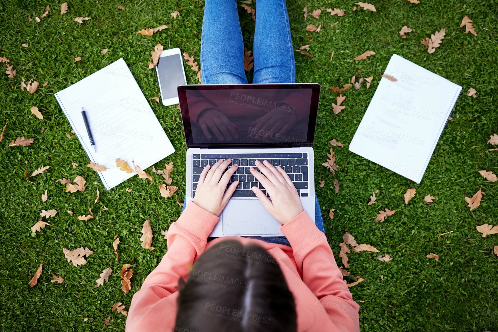 Buy stock photo Student, laptop and notebook on grass for learning, research and studying on campus. Woman, computer and typing outdoors at university for elearning, networking and online education from above