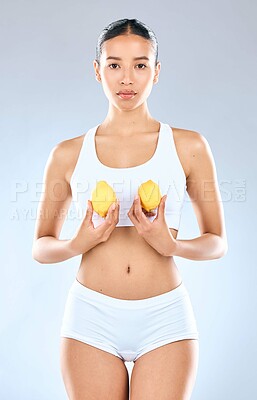 Buy stock photo Skincare, woman and lemons for dermatology, vitamin c and nutrition for healthy body in studio. Female person, fruit and natural treatment for shine or glowing skin with wellness on white background