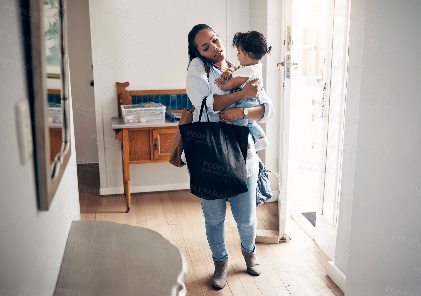 Buy stock photo Woman, phone call and bags with baby in home, multitasking and busy with responsibility. Mother, holding infant and talking to freelance client for remote work, shopping errands and entrepreneur