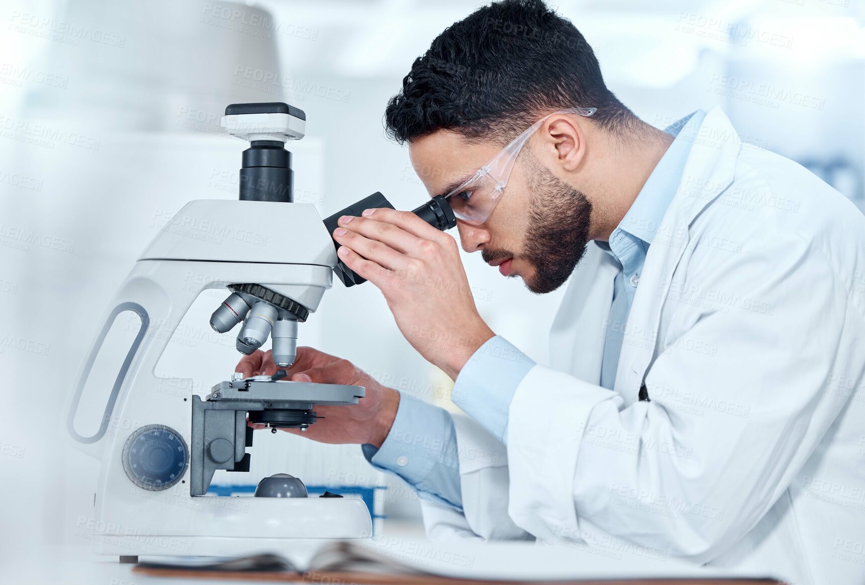 Buy stock photo Man, microscope and examine research in lab, biochemist and innovation healthcare study with virus sample. Investigation, cure development and disease analysis or breakthrough, medical and equipment
