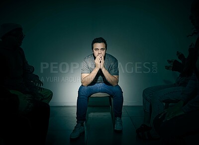 Buy stock photo Mental health, portrait and psychology with man in studio on dark background for rehabilitation. Bipolar, depression and fear with patient person in spotlight for healthcare or medical assessment