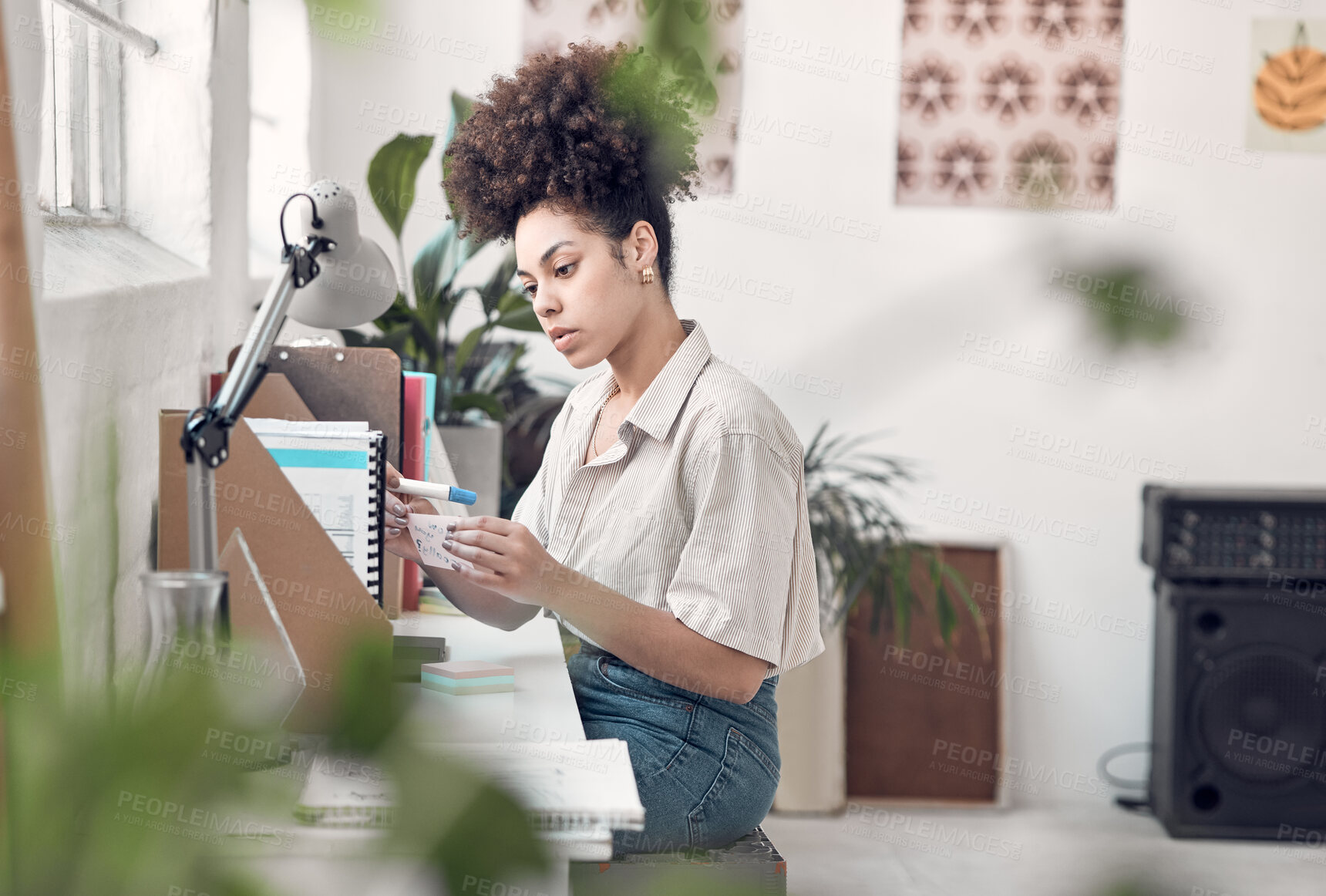 Buy stock photo Idea, reminder and planning with woman at desk in office for design, sticky notes or research. Development, pen and thinking with African employee in creative workplace for small business startup