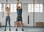 Fitness, active and healthy couple stretching, exercising or training together inside gym. Two young fit trainer doing a full body workout exercise or warmup routine in the day time with copy space