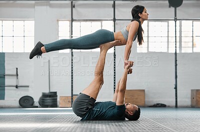 Buy stock photo Healthy, fit and active couple doing a workout, exercise and fitness routine for a lifestyle of health. Young boyfriend and girlfriend exercising, training and balancing together inside a gym