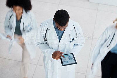 Buy stock photo Doctor, digital tablet test and medical worker with research lab data on technology in busy hospital from above. Healthcare man, working people and insurance employee in medicine wellness health room