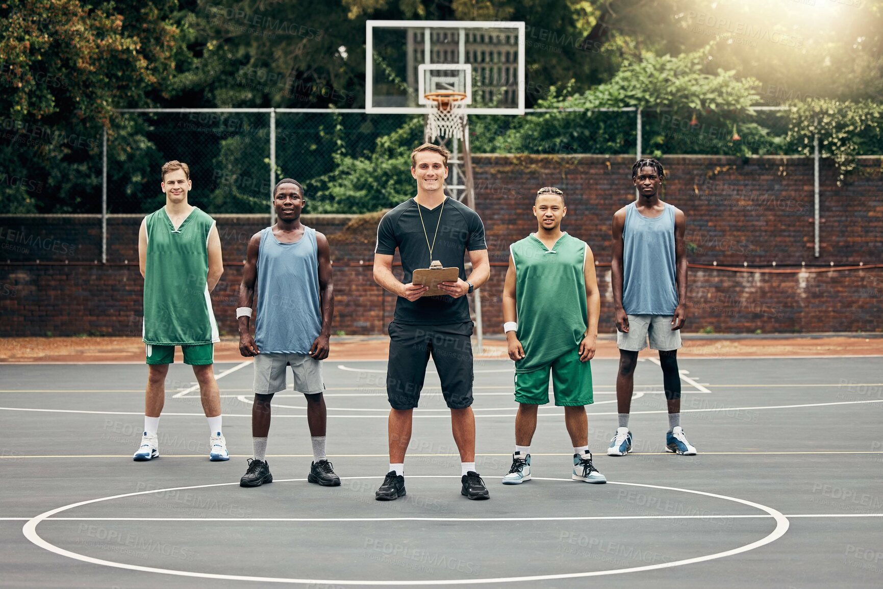 Buy stock photo Basketball, sport and team with a coach training his players on a court outdoor during summer. Teamwork, fitness and exercise with a sports group of male athletes ready for a workout or game