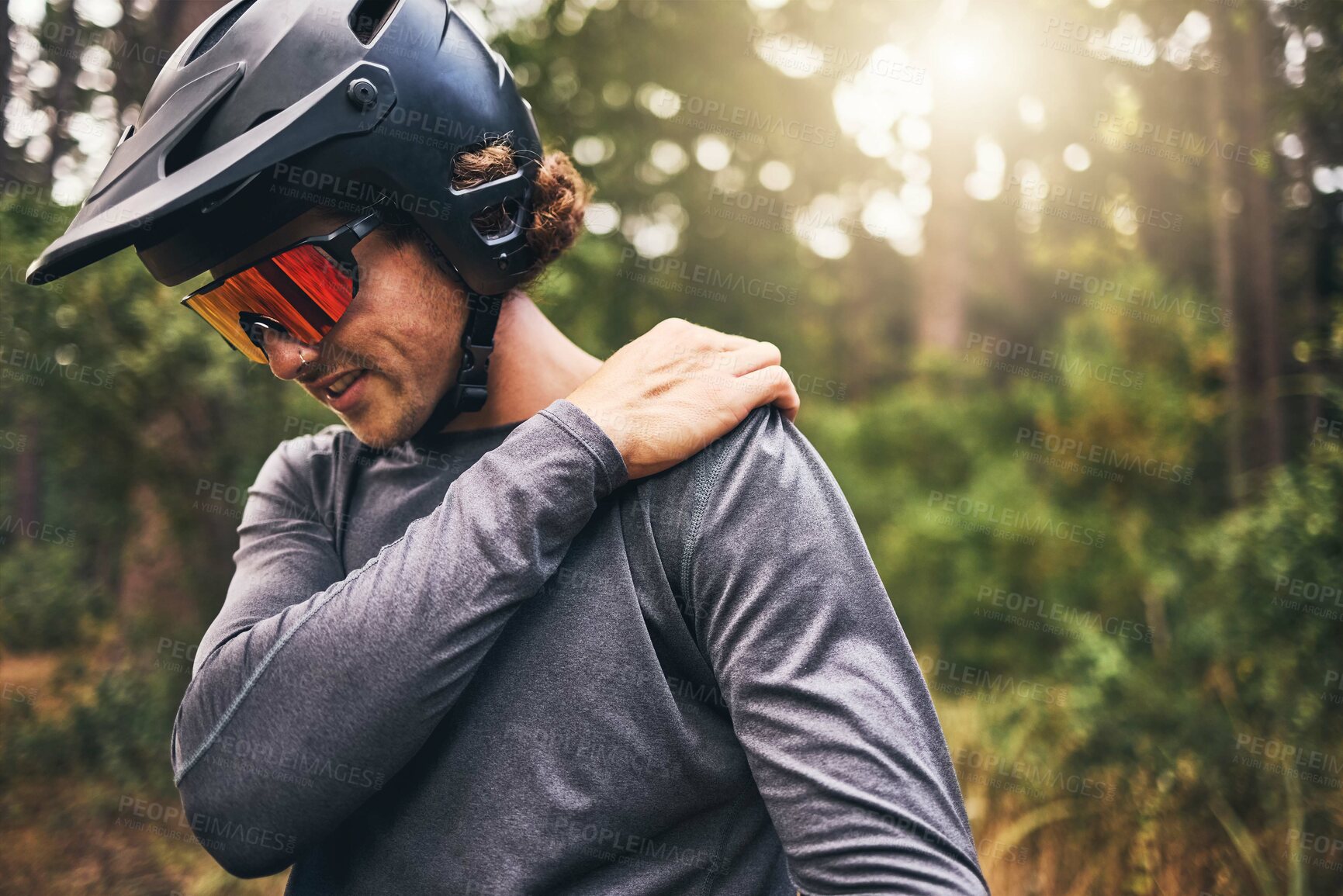 Buy stock photo Bike cyclist, fitness and injury in nature forest, environment or Australian woods after exercise, training and workout. Shoulder pain, medical emergency and healthcare for sports man after accident