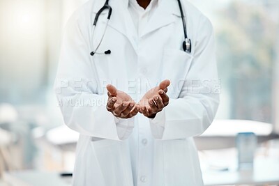 Buy stock photo Doctor, hands and open in hospital for help, healthcare or medical support with welcome, care and trust. Black doctor, medic man and health worker in clinic, empty palm and stethoscope in workplace