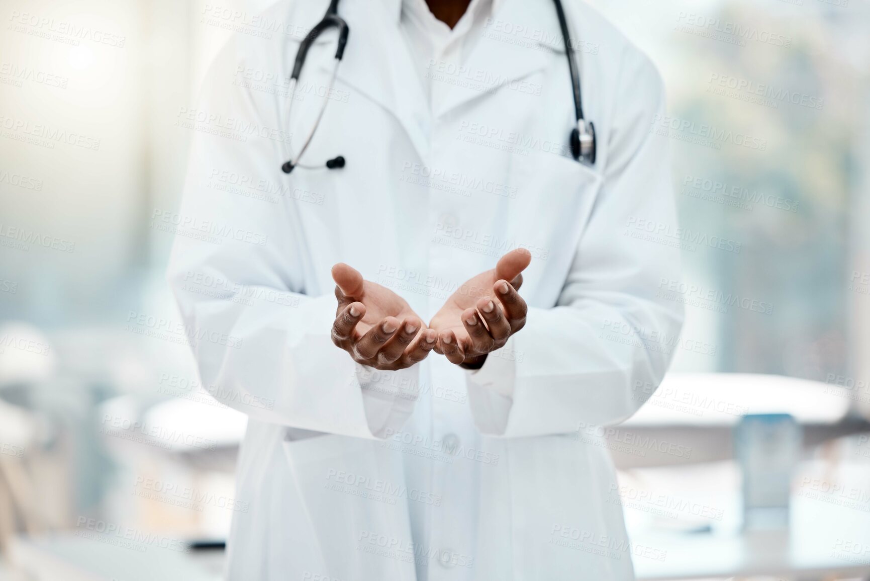 Buy stock photo Doctor, hands and open in hospital for help, healthcare or medical support with welcome, care and trust. Black doctor, medic man and health worker in clinic, empty palm and stethoscope in workplace