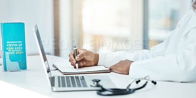 Buy stock photo Covid, laptop and writing with a doctor working on research in an office in the hospital for cure or treatment. Computer, notebook and healthcare with a medicine professional working on medical care