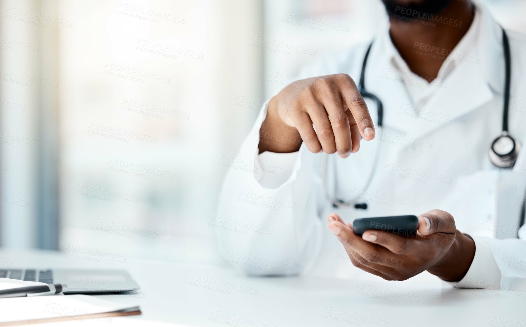 Buy stock photo Doctor, hands and phone in hospital office for telehealth, online consultation or research. Healthcare, mobile tech and black female physician on 5g smartphone, wellness app or checking medical email