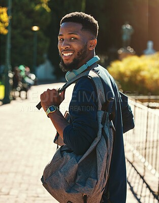 Buy stock photo Black man, student on campus  for university in outdoor portrait, education and study with backpack. College, smile and higher education with learning for development and scholarship, going to class.