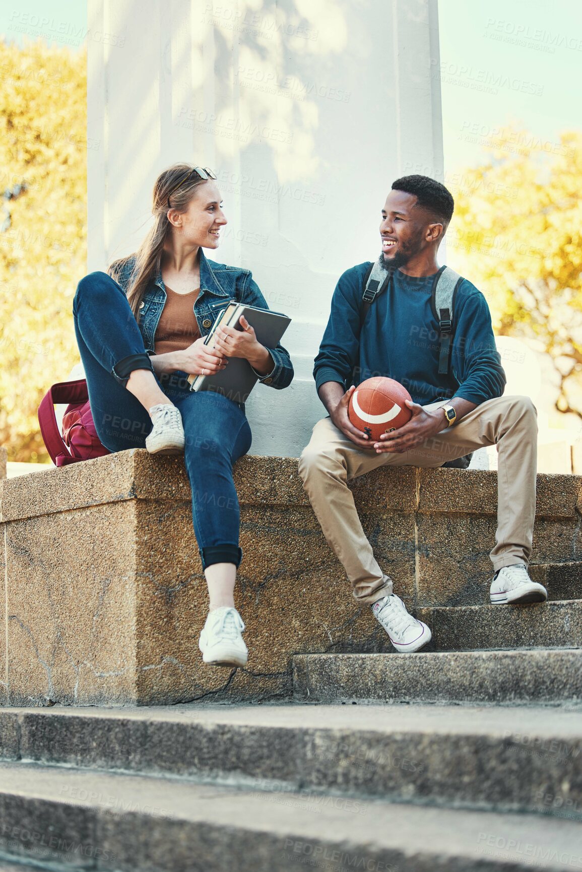 Buy stock photo Friends, students and bonding on university campus for studying, education and knowledge. Summer, friendship and man and woman higher education people talking about school work and studies or sports
