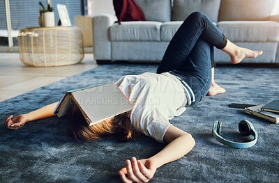 Buy stock photo Education, tired and book with a woman student lying on the floor of her living room, sleeping in a home. Learning, exhausted and reading with a female college pupil asleep in a house while studying