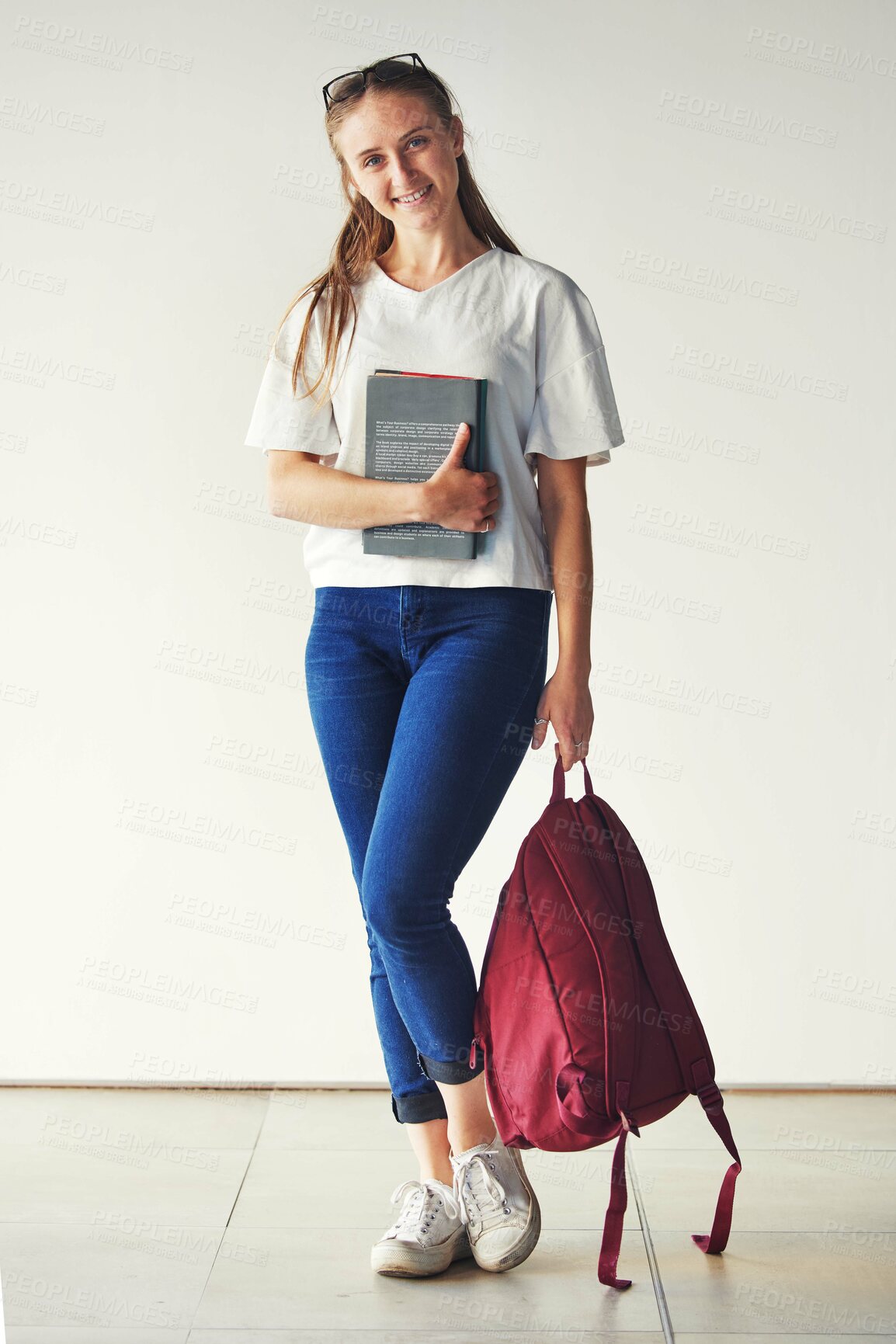 Buy stock photo Studying, books and student at a college for education, knowledge and scholarship with a smile. School, happy and portrait of a girl ready for university with backpack on campus for higher education