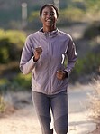 Fitness, running and black woman on mountain for exercise, marathon training and workout in nature. Sports, wellness and happy female athlete run, jog and exercising for healthy lifestyle in morning