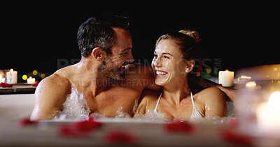 Buy stock photo Happy couple, night and relax with pool for date, holiday or honeymoon vacation together at luxury resort. Man, woman or lovers enjoying water with hot tub in late evening for romance or getaway