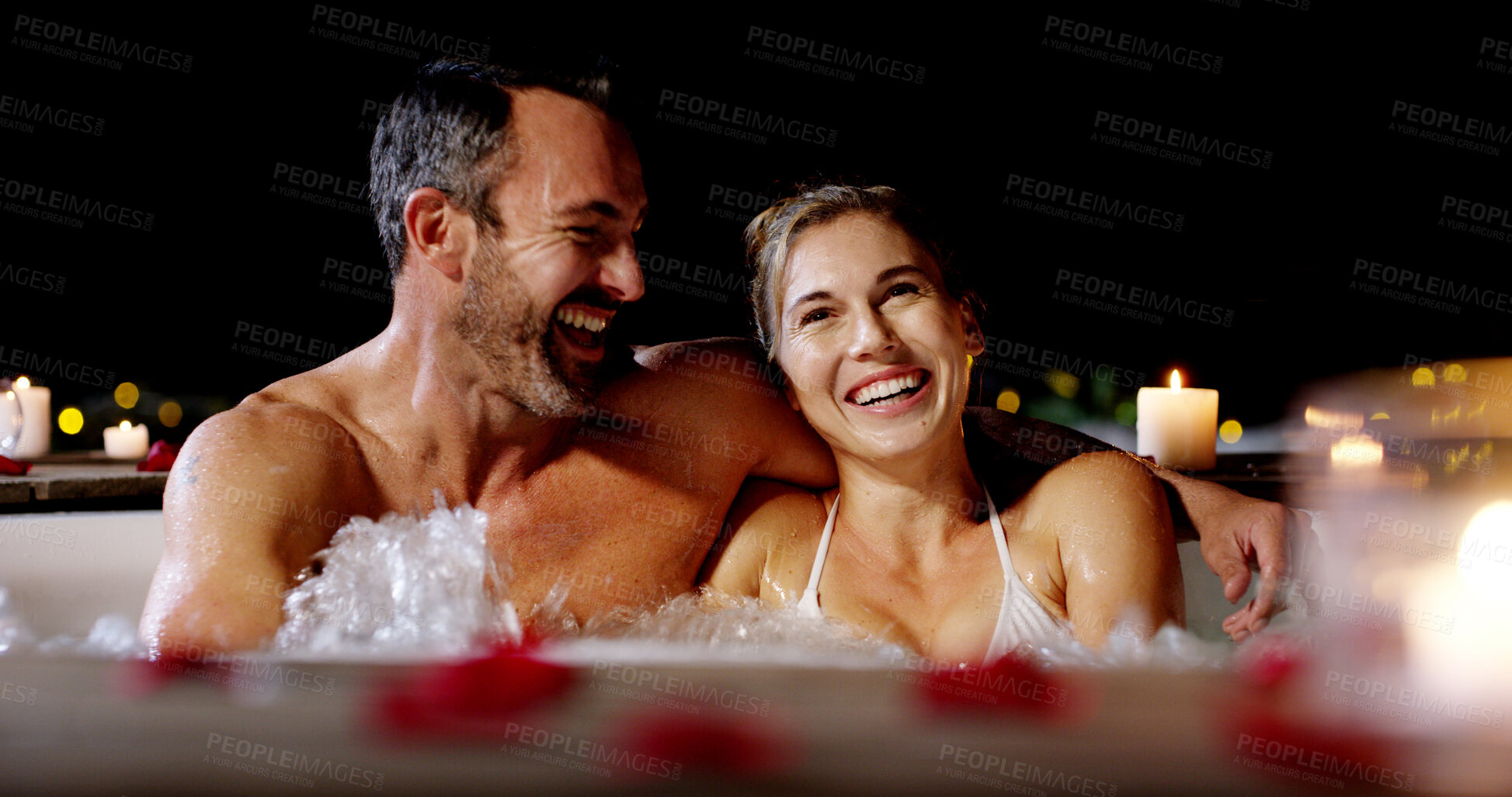 Buy stock photo Happy couple, night and relax with pool for honeymoon vacation, holiday or date together at luxury resort. Man, woman or lovers enjoying water with hot tub in late evening for romance or getaway