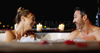 Buy stock photo Happy couple, night and talking with pool for honeymoon vacation or luxury holiday together at resort. Man, woman or lovers enjoying water with hot tub in late evening for love, romance or getaway