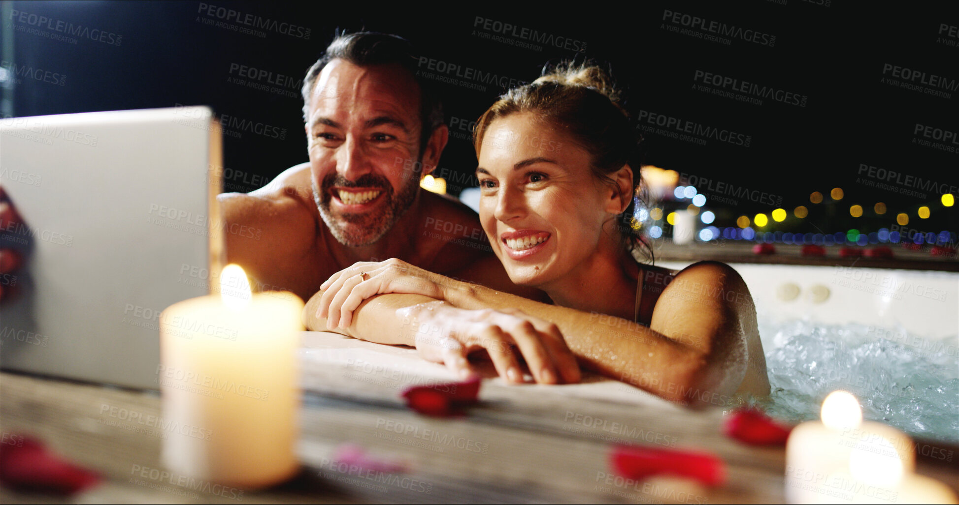 Buy stock photo Happy couple, night and pool with tablet for vacation, honeymoon or holiday getaway at outdoor spa. Man, woman or lovers with smile on technology for hot tub selfie, memory or picture at resort