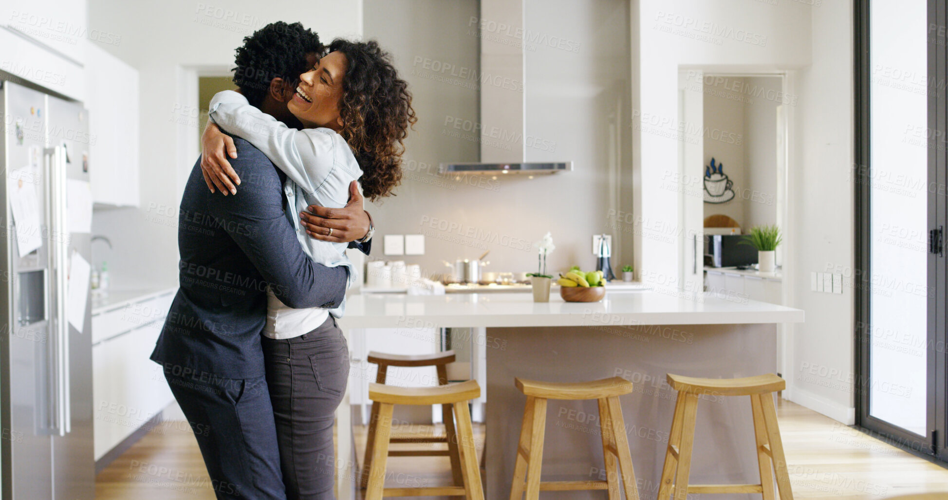 Buy stock photo Couple, hug and excited for love in home, support and happiness for security in relationship. People, commitment and care for romantic partnership in kitchen, embrace and love together in marriage