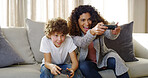 Video, game and mom on couch with son, smile and competition for bonding together in home. Excited, mother and child on sofa with control for playing online with happy energy, electronics and fun