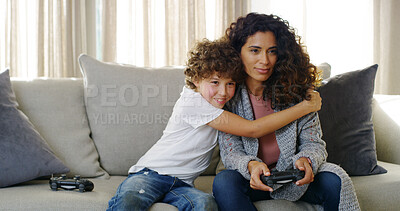 Buy stock photo Video game, hug and mom on sofa with son, smile and competition support for bonding together in home. Fun, mother and happy child embrace on couch with control, playing online and steaming technology