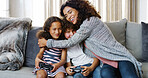 Kids, family home and video game with mom, hug and bonding together in living room. Technology, remote and  gaming with sibling, smile and online competition with fun, joy and weekend with love