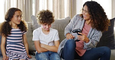 Buy stock photo Fun, gaming and laughing with family on sofa in living room of home together for competition. Daughter, upset son and winner mother playing video game in apartment for bonding, challenge or level up