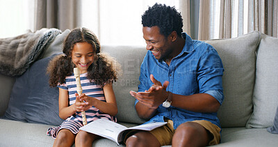 Buy stock photo Learning, music and kid with father for flute lesson on sofa with book for notes in home. Education, bonding and dad teaching girl child to play recorder instrument for talent development in house.