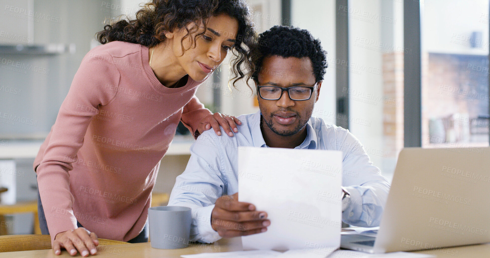 Buy stock photo Interracial couple, paperwork and laptop with finance for budget planning, expenses or bills at home. Man, woman or documents with computer for mortgage payment, invoices or financial report at house