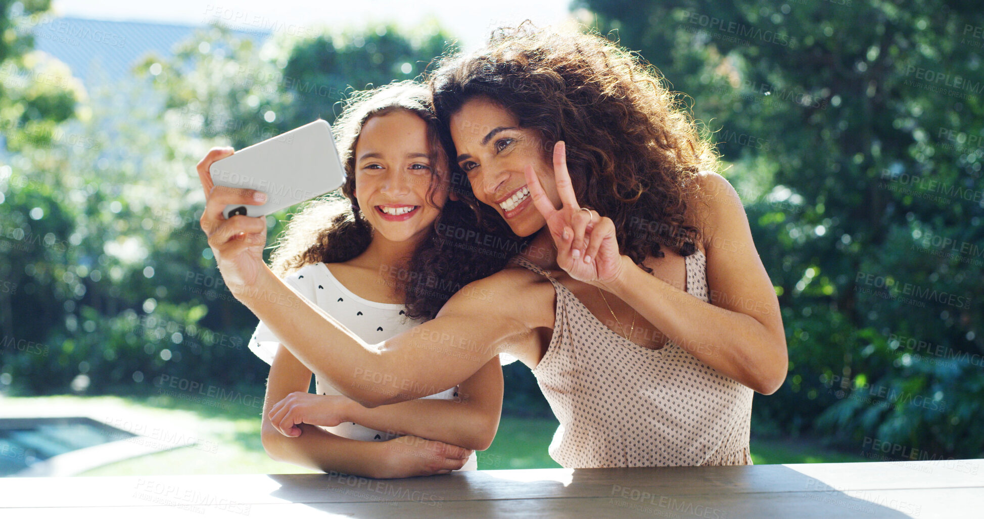 Buy stock photo Selfie, peace sign and mother with daughter in park for social media, memory and bonding. Love, support and photography with woman and young girl in garden of family home for picture, summer and care