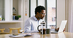 Businessman, laptop and thinking with remote agency, coffee and ideas for solution or brainstorming. African, entrepreneur or brand consultant with project, proposal or online startup in home kitchen