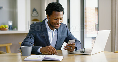 Buy stock photo Black man, laptop and work from home with phone, social media and professional with online business. Startup, smile and website update for ecommerce, freelancer and technology at kitchen table