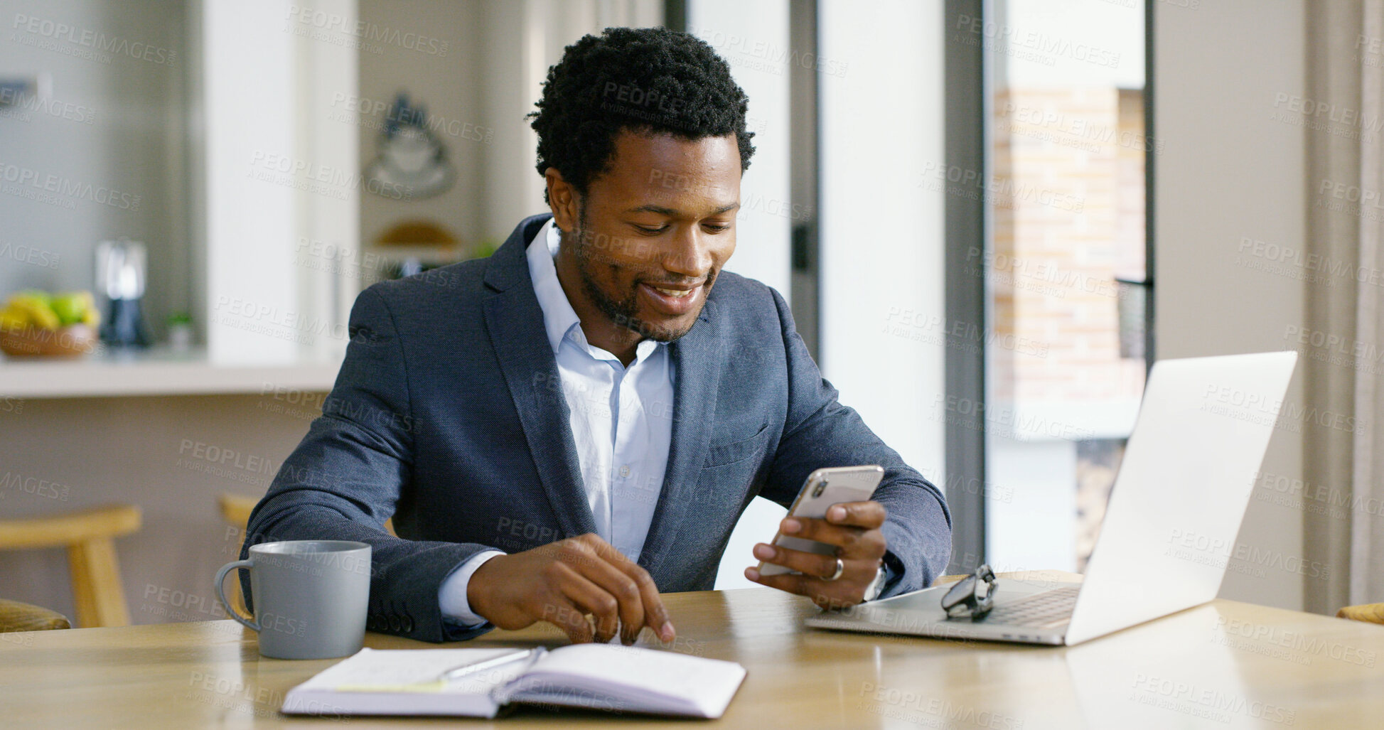 Buy stock photo Black man, laptop and work from home with phone, social media and professional with online business. Startup, smile and website update for ecommerce, freelancer and technology at kitchen table