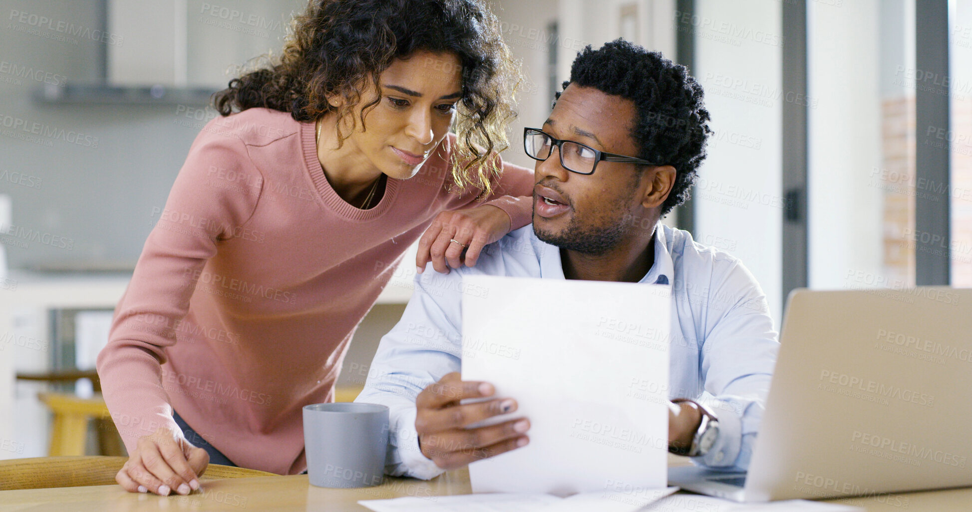 Buy stock photo Interracial couple, documents and discussion with laptop for finance, bills or home expenses. Man, woman or discussing with paperwork or computer for mortgage, financial report or budget planning