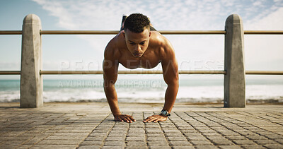 Buy stock photo Fitness, man or push up at beach for exercise, balance or upper body workout. Bodybuilder, training or muscular person on ocean promenade with commitment, endurance or intense activity for strength