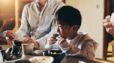 Buy stock photo Japanese boy, family and eating in home with youth, lunch and dining room together with sushi. Food, hungry and dinner table with diet, kid and care with chopsticks and meal for health and nutrition